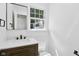 Modern bathroom featuring a wooden vanity and sleek fixtures at 6838 Johnson Rd, Indianapolis, IN 46220