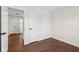 Bedroom has hardwood flooring, a neutral color palette, and access to the bathroom at 6838 Johnson Rd, Indianapolis, IN 46220