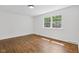 Inviting bedroom featuring hardwood floors and natural light at 6838 Johnson Rd, Indianapolis, IN 46220