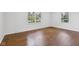 Bright bedroom with hardwood floors, recessed lighting, and large windows at 6838 Johnson Rd, Indianapolis, IN 46220