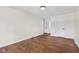 Bright bedroom features hardwood floors, neutral walls and doors leading to other rooms at 6838 Johnson Rd, Indianapolis, IN 46220
