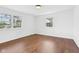 Sunlit bedroom featuring hardwood floors and bright windows at 6838 Johnson Rd, Indianapolis, IN 46220