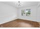 Well-lit dining room featuring hardwood floors and bright windows at 6838 Johnson Rd, Indianapolis, IN 46220