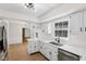 Charming kitchen with white cabinets, quartz counters, and stainless steel appliances at 6838 Johnson Rd, Indianapolis, IN 46220