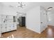 Bright kitchen featuring modern lighting, hardwood floors, and modern appliances at 6838 Johnson Rd, Indianapolis, IN 46220
