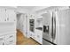 Modern kitchen with stainless steel appliances and a doorway into another room at 6838 Johnson Rd, Indianapolis, IN 46220
