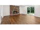 Bright living room with brick fireplace and sliding glass doors at 6838 Johnson Rd, Indianapolis, IN 46220