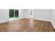 Open-concept living room featuring hardwood floors and natural light at 6838 Johnson Rd, Indianapolis, IN 46220