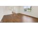 Spacious living room with hardwood floors and bright natural light from large window at 6838 Johnson Rd, Indianapolis, IN 46220