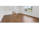 Bright living room featuring hardwood floors, recessed lighting, and a large window at 6838 Johnson Rd, Indianapolis, IN 46220