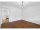 Living room featuring hardwood floors and bright lighting at 6838 Johnson Rd, Indianapolis, IN 46220