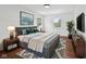 Staged Main Bedroom featuring hardwood floors and neutral decor at 6838 Johnson Rd, Indianapolis, IN 46220