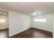 Clean bedroom with hardwood floors, neutral walls, and modern lighting perfect for relaxation at 702 S Keystone Ave, Indianapolis, IN 46203