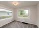 Bright and airy bedroom with plush carpeting and large windows at 702 S Keystone Ave, Indianapolis, IN 46203
