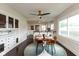 Charming dining area adjacent to the kitchen with built-in cabinets at 702 S Keystone Ave, Indianapolis, IN 46203
