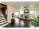 Inviting living room featuring a classic fireplace and hardwood floors at 702 S Keystone Ave, Indianapolis, IN 46203