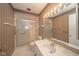 Bathroom with a single vanity, shower, and large mirror with lighting at 7317 Lions Head Dr # A, Indianapolis, IN 46260