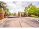 Gated private community residence featuring stone lion statues on brick pillars at its entrance at 7317 Lions Head Dr # A, Indianapolis, IN 46260