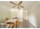 A bright dining room is anchored by a ceiling fan and leads to multiple doors and closets at 7317 Lions Head Dr # A, Indianapolis, IN 46260