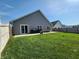Spacious backyard featuring a large concrete patio, perfect for outdoor enjoyment at 7511 Eddie Ln, Camby, IN 46113