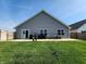 Well maintained backyard with a concrete patio and privacy fence at 7511 Eddie Ln, Camby, IN 46113