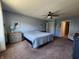 Spacious bedroom features a ceiling fan, neutral tones, and ample closet space at 7511 Eddie Ln, Camby, IN 46113