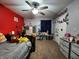 Bright bedroom with playful decor, a ceiling fan, and built-in storage at 7511 Eddie Ln, Camby, IN 46113
