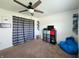 Relaxing bedroom space with a ceiling fan, window, shelving, and a comfy beanbag chair at 7511 Eddie Ln, Camby, IN 46113