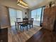 Cozy dining area with natural light from sliding doors, table with chairs, and a decorative area rug at 7511 Eddie Ln, Camby, IN 46113