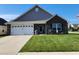 Charming single-Gathering home with a well-manicured lawn, brick facade, and a two-car garage in a suburban neighborhood at 7511 Eddie Ln, Camby, IN 46113