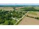 Beautiful aerial perspective showcasing location relative to neighborhood, trees, and road at 7516 S County Road 300 W, Clayton, IN 46118