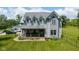 Charming two-story home with a covered porch and lush lawn, perfect for outdoor enjoyment at 7516 S County Road 300 W, Clayton, IN 46118