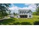 Charming two-story home with a covered porch and lush lawn, perfect for outdoor enjoyment at 7516 S County Road 300 W, Clayton, IN 46118