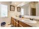 Bright bathroom with a double vanity, lots of counter space and natural light from two windows at 7685 River Rd, Indianapolis, IN 46240