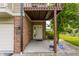 Inviting entrance with brick accents, ADT security, and well-maintained landscaping at 7685 River Rd, Indianapolis, IN 46240