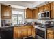 Cozy kitchen featuring stainless steel appliances and granite countertops at 7685 River Rd, Indianapolis, IN 46240