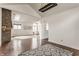 Spacious living room featuring stone fireplace, skylights and hardwood floors at 7685 River Rd, Indianapolis, IN 46240