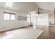 Bright open-concept living room with skylights and hardwood floors at 7685 River Rd, Indianapolis, IN 46240