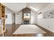 Living room with a cozy stone fireplace and skylights, perfect for relaxation at 7685 River Rd, Indianapolis, IN 46240