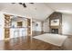 Inviting living room with a stone fireplace, breakfast bar, and open layout at 7685 River Rd, Indianapolis, IN 46240