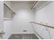 Empty walk-in closet with shelving and neutral carpet at 7685 River Rd, Indianapolis, IN 46240