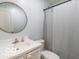 Cozy bathroom with single sink, vanity, toilet, and shower with curtain at 774 Courtney Cir, Danville, IN 46122