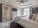 Bedroom featuring a tray ceiling, ceiling fan, and decor at 774 Courtney Cir, Danville, IN 46122