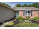 Inviting front entrance with a decorative door, brick accents, and colorful landscaping enhancing curb appeal at 774 Courtney Cir, Danville, IN 46122