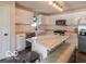 Bright eat-in kitchen boasts white cabinetry, butcher block countertops, and a stylish marble island at 774 Courtney Cir, Danville, IN 46122
