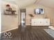 Open concept living room featuring modern flooring and decor at 774 Courtney Cir, Danville, IN 46122
