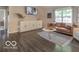 Stylish living room featuring hardwood floors, a comfortable leather couch, and ample natural light at 774 Courtney Cir, Danville, IN 46122
