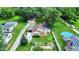 Aerial view of a home showcasing a fenced yard, above-ground pool, garden, and driveway at 8019 E Hanna Ave, Indianapolis, IN 46239