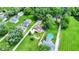 An aerial perspective highlights the home's position among mature trees and other residences at 8019 E Hanna Ave, Indianapolis, IN 46239