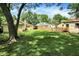 Large backyard with a new wooden fence and ample green space, perfect for outdoor activities at 8019 E Hanna Ave, Indianapolis, IN 46239